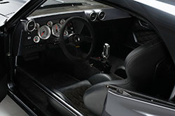 The cockpit is set up for serious driving with supportive seats and an array of analog gauges.