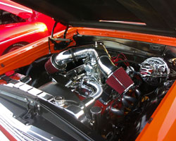 A Spectre Performance dual plenum intake system sits atop a Demon 650 carburetor feeding fuel and air into the 350 Chevy Small Block