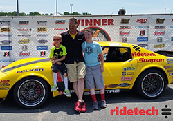 Chris Smith with his sons Colin and Jason in the winner's circle during the Goodguys' East Coast Nationals
