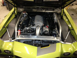 Johnson designed a dual Spectre air filter intake system using several Spectre components for his 1972 Camaro at SEMA
