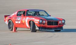 Mary Pozzi in her '73 Inferno Orange Camaro RS