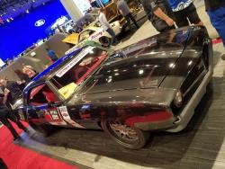 Side and top view of Intro Wheels Camaro with focus on two-tone paint and red interior