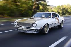 Driver view of Rodney Prouty in "Plain Jane" his '68 Camaro driving down the road