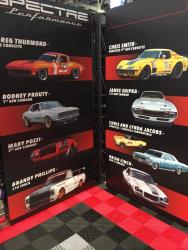 Photo of the Spectre Team Driver's vehicles on the Spectre Performance Booth Display boards