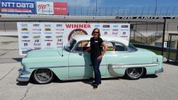 Lynda Jacobs featured next the the '54 Chevy she won with at the Goodguys Lone Star Nationals