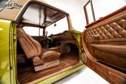 1955 Chevy Nomad interior featuring door panel, seats, carpet and dash