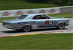 Passenger side view of Chris Jacobs on the road course at Road America 