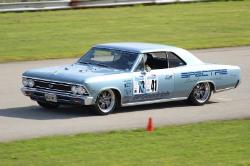 Driver side view of Chris behind the wheel at the MidWest Muscle Car Challenge