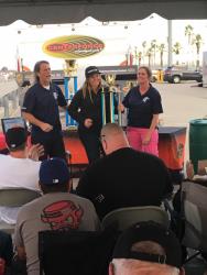 Rob and Trish Byrd present Brandy Phillips with Hotchkis Cup Truck Class Trophy