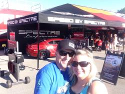 Photo of Kay & Jason Luebcke in the pits at the Spectre Booth