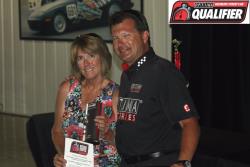 Mary Pozzi and Optima Series Race Director, Jimi Day, as he presents her with the OUSCI Invite