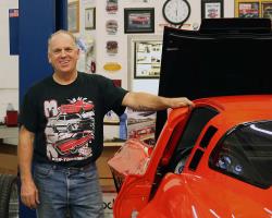 Greg Thurmond standing next to his '65 Corvette